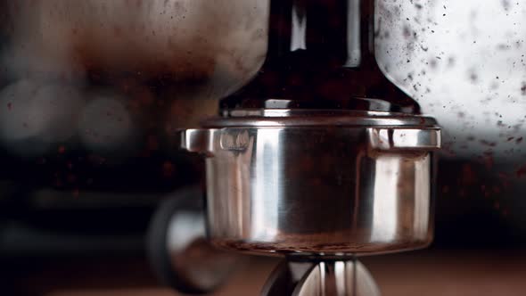Super Slow Motion Shot of Tamping Fresh Ground Coffee at 1000Fps alt