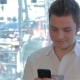  Of Man Uses Cellphone At The Cafe - VideoHive Item for Sale