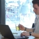 Man Uses Laptop At The Cafe - VideoHive Item for Sale