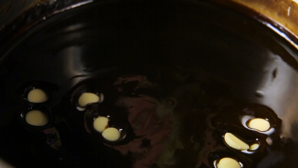 White Chocolate Mugs Fall Into a Metal Pan
