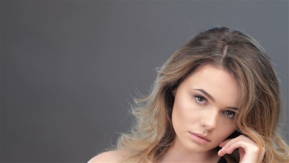 Sexy Female Model Toching Her Face alt