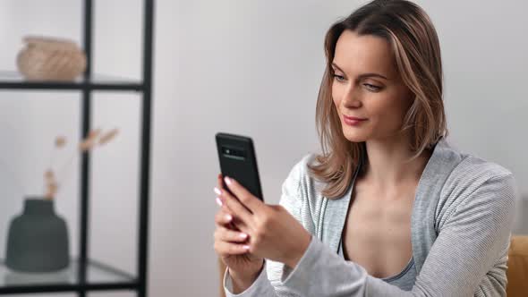 Pleasant Woman Smiling Chatting Typing Message Use Smartphone alt