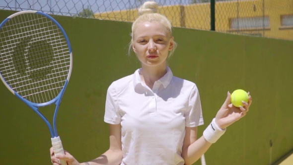 Beautiful Young Blond Tennis Player Posing alt