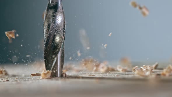 Super Slow Motion Detail Shot of Drilling Wood at 1000 Fps. alt