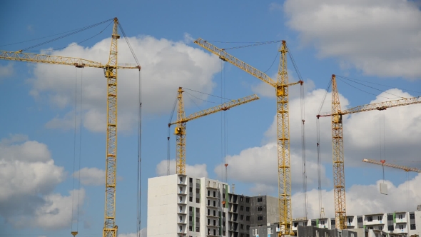 Construction Cranes Against  Sky