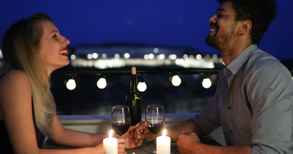 Beautiful Couple in Love Having Romantic Dinner at Night