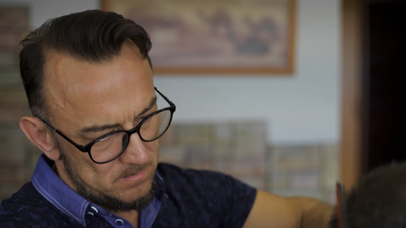 Stylish Professional Barber At Work alt