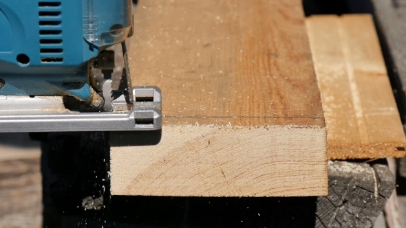 Man Sawing Plank Electric Fretsaw  alt
