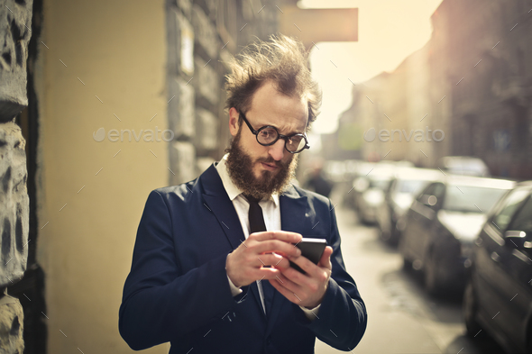 Businessman with phone - Stock Photo - Images