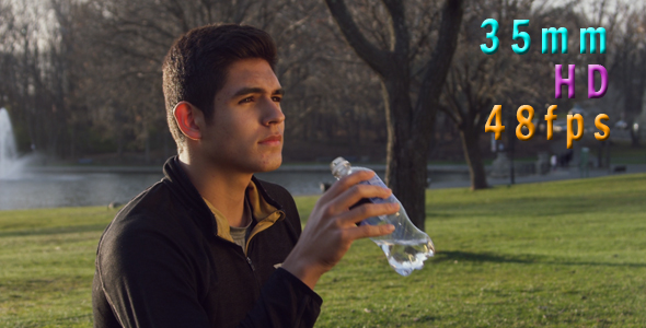 Man Drinking Water From the Bottle Outdoors 12