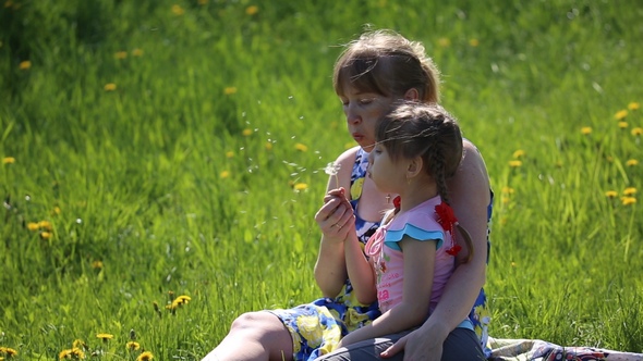 The Mother with Daughter Blowing on a Dandelion alt