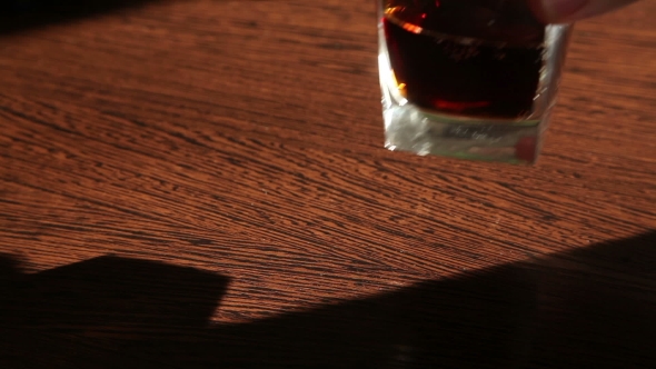 Whiskey And Cola Is On The Table - The Man's Hand Taking a Glass  