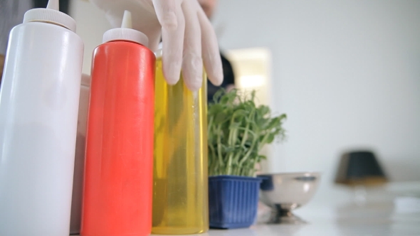 A Chef Is Using Ingredients To Cook Meals alt