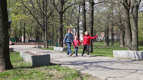 Kids Running on The Alley in Park