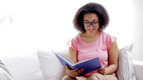 African American Young Woman Reading Book At Home 89 alt