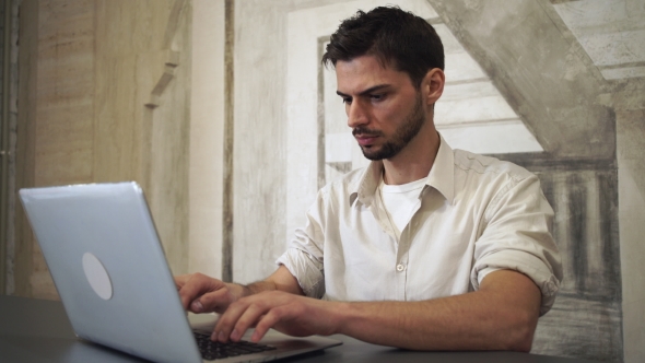 Portrait Young Professional Man Working On Computer. alt