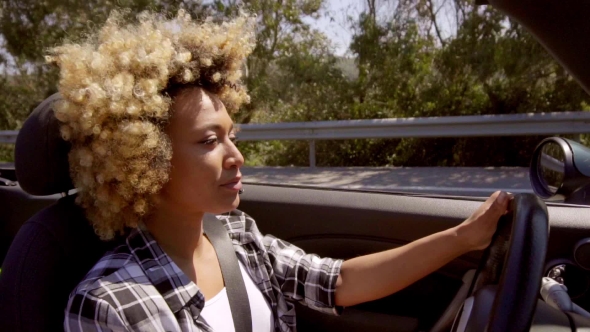 Attractive Young African American Woman Driving alt