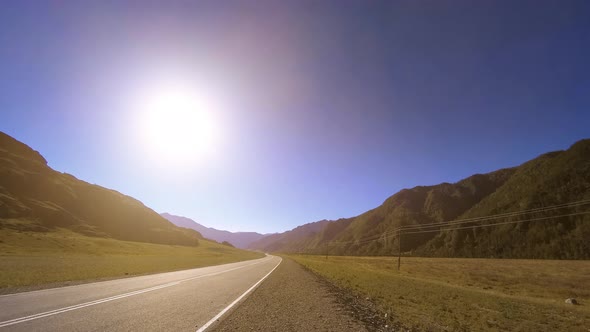 Mountain Road Timelapse at the Summer or Autumn Sunset Sunrise Time alt