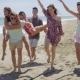 Group Of Young Friends Frolicking On a Beach - VideoHive Item for Sale