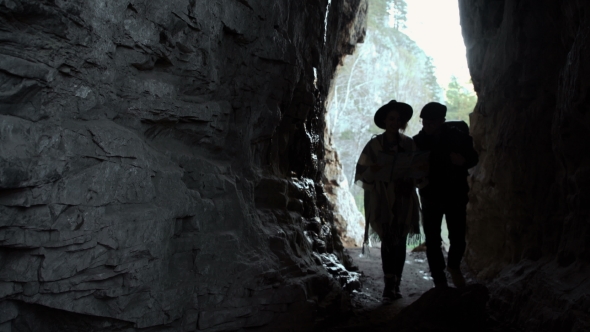 Couple Hiking. Using Map To Get Good Direction alt