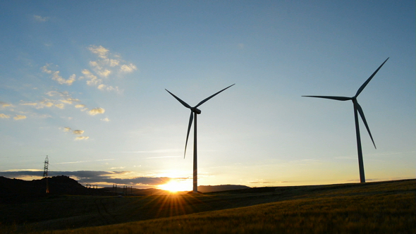 Wind Turbines Towers at Sunset alt