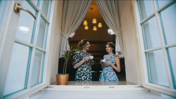 Two Old Fashioned Woman Drink Tea And Talking alt