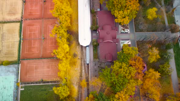 Aerial railway station in yellow autumn forest