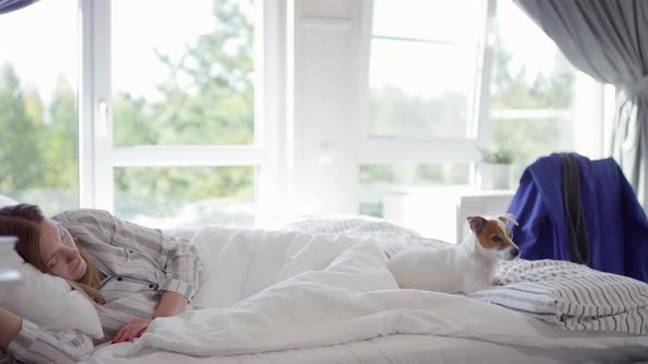 Woman Sleeping in Bed in Morning alt