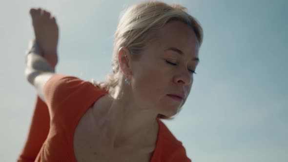 Portrait of Yoga Woman in Training During Asana on the Nature alt