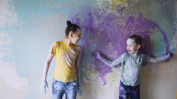 Funny Dirty Children Play with Paints and Colour Room Wall