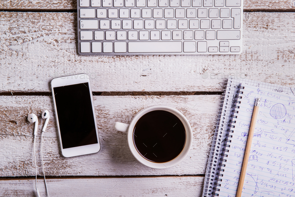 Desk, gadgets and office supplies. Flat lay. Copy space. Stock Photo by  halfpoint