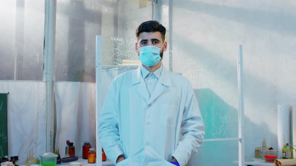 In Front of the Camera Posing Man Scientist in the alt