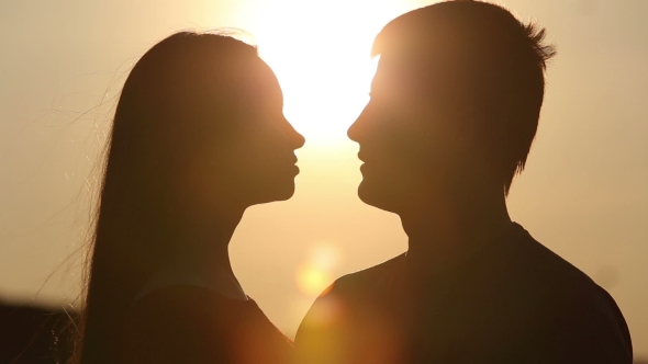 Beautiful Young Couple In Love Kiss In The Sun