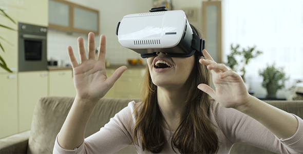 Woman Using VR Goggles Device For Mobiles