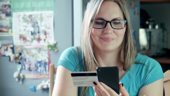 Beautiful Blonde Woman Shopping Online On Internet alt