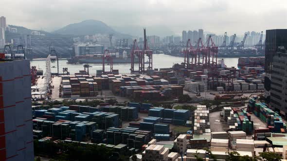 Container Port Hong Kong Harbor with Cargo Ships Against City alt
