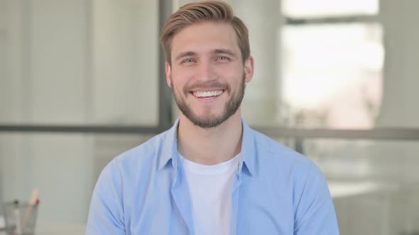 Portrait of Young Creative Man Smiling at Camera alt