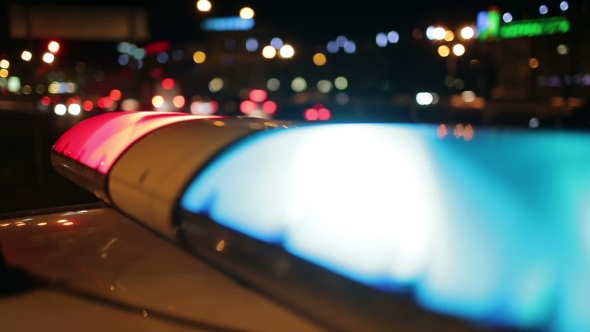 Police Lights Flashing At Night Downtown alt