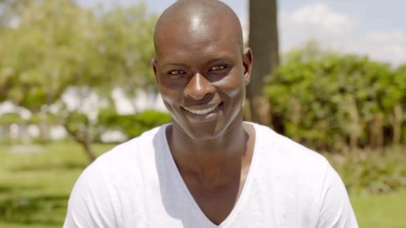 Smiling Handsome Bald Black Man In The Park By D