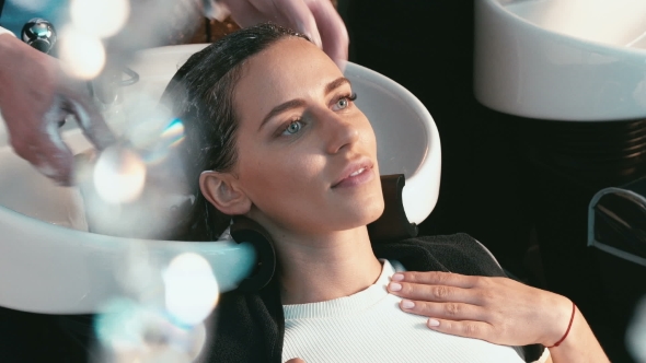 Girl In a Beauty Salon Wash The Head alt