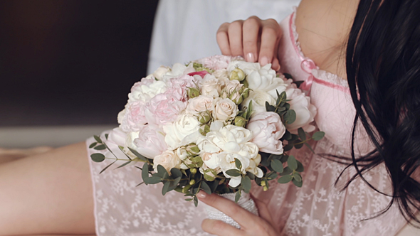 Happy Bride Holding Bouquet Of Flowers