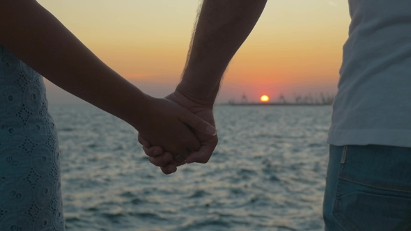 Hand In Hand By The Sea At Sunset, Stock Footage | VideoHive