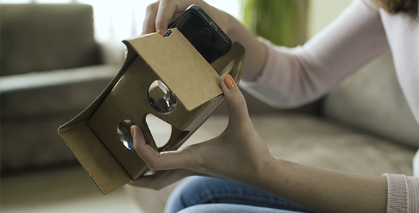 Girl Set Up Cardboard VR Headset