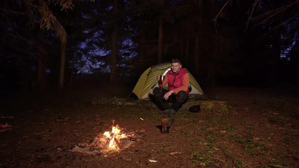 A Man Near a Bonfire alt