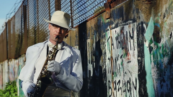 Saxophonist Against a Wall With Graffiti And Power Lines. Series. 