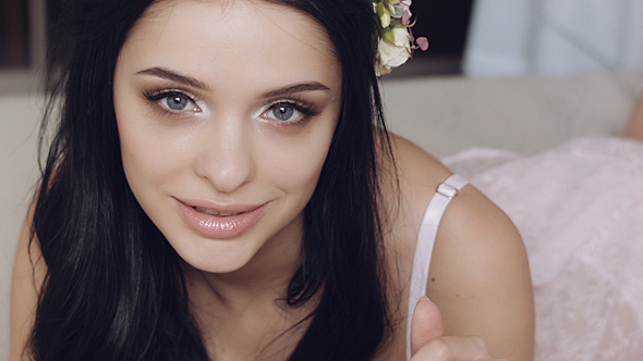 Sexy Girl With Flowers On The Bed