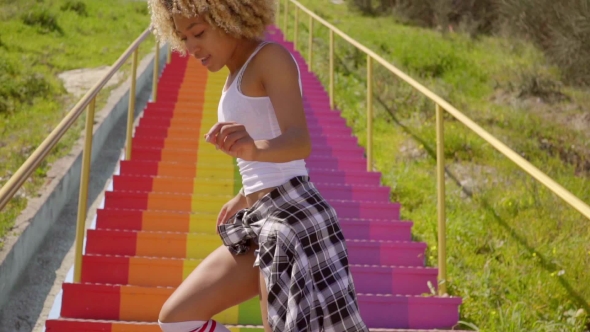 Young Woman Dancing On The Stairs. alt
