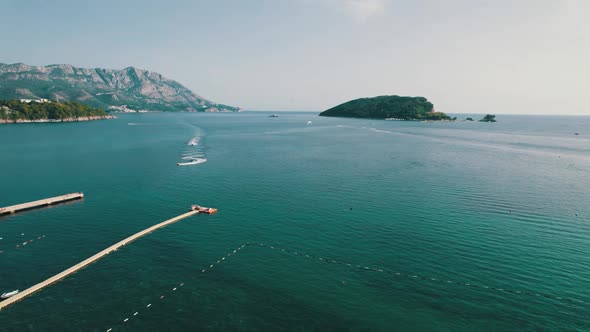 Aerial View of the Resort Sea Beach with Boats and Jet Skis in Budva Montenegro alt