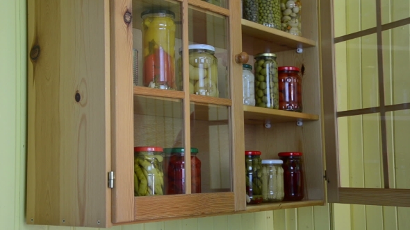 Hand Open Wooden Cupboards Door Puts Jar Canned Garlic
