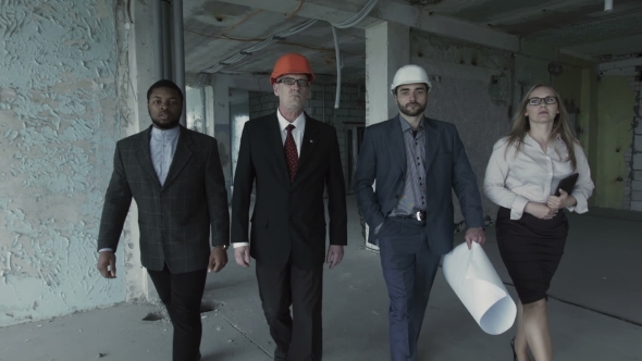 Team Of Builders In Suits, Hard Hat, Move, Look Directly Into Camera. Black Man, Aged Engineer alt
